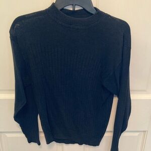 Black ribbed turtleneck by Alex.